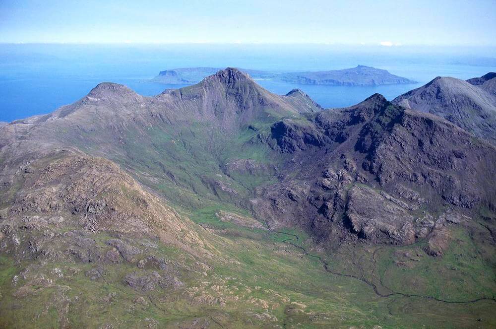 Rum Cuillin from Barkeval. Eigg distant